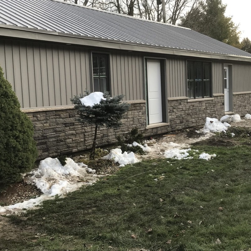 Addition added to existing house with steel & brick siding