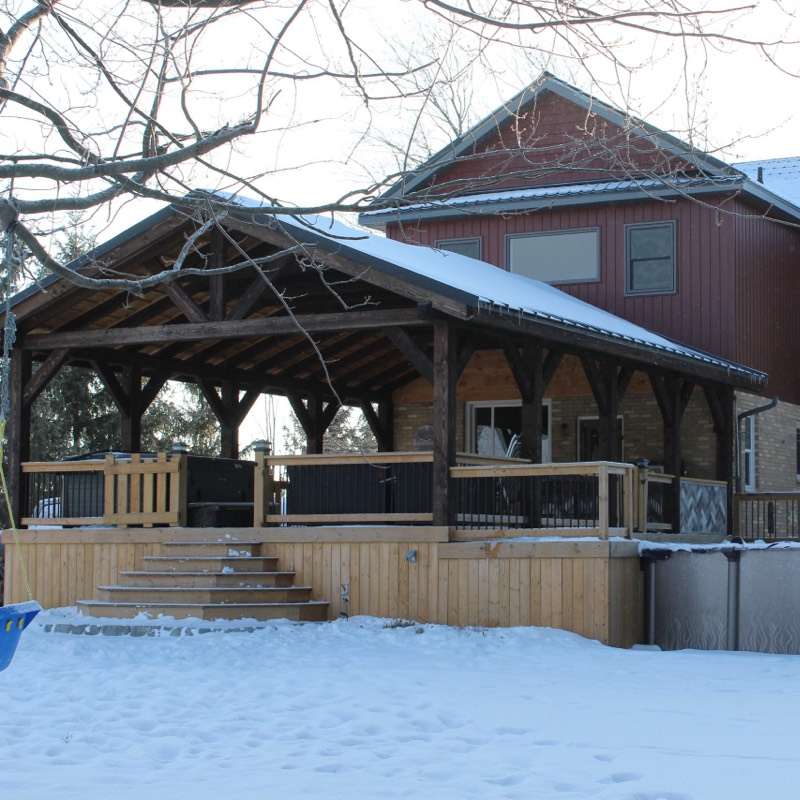 Timber frame pavilion overtop of wood deck