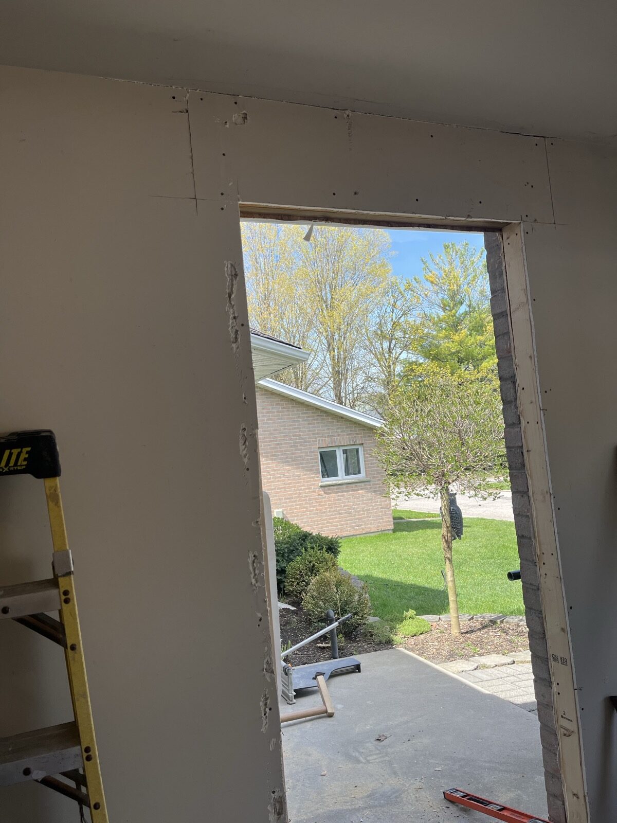 Newly cut-in door opening to the backyard